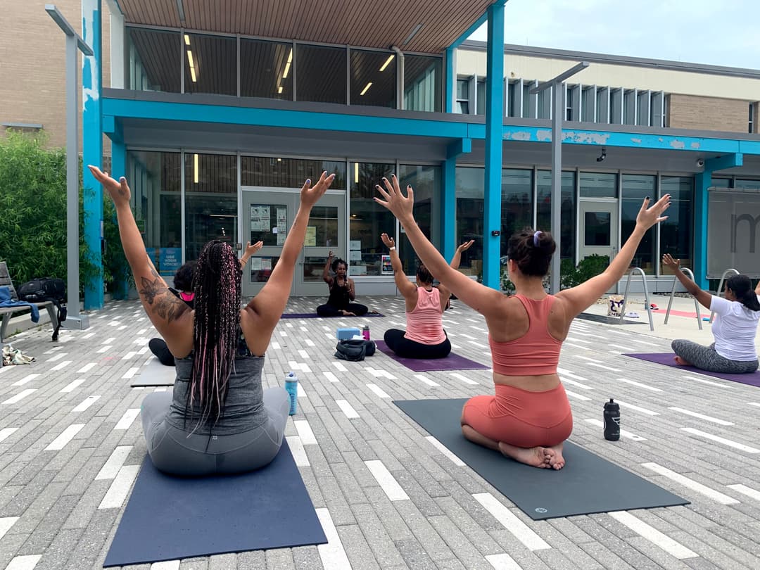 praticing yoga infront of house